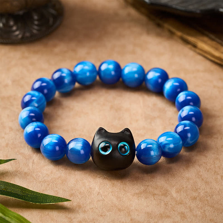 Buddha Stones Pulsera de equilibrio con forma de gato, cuentas de resina azul y madera de ébano. - image 1