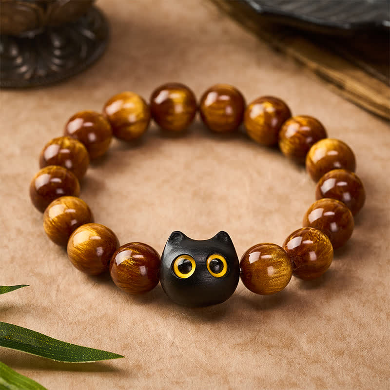 Buddha Stones Pulsera con cuentas de resina amarilla, ojos amarillos y diseño de gato tranquilo en madera de ébano. - image 1