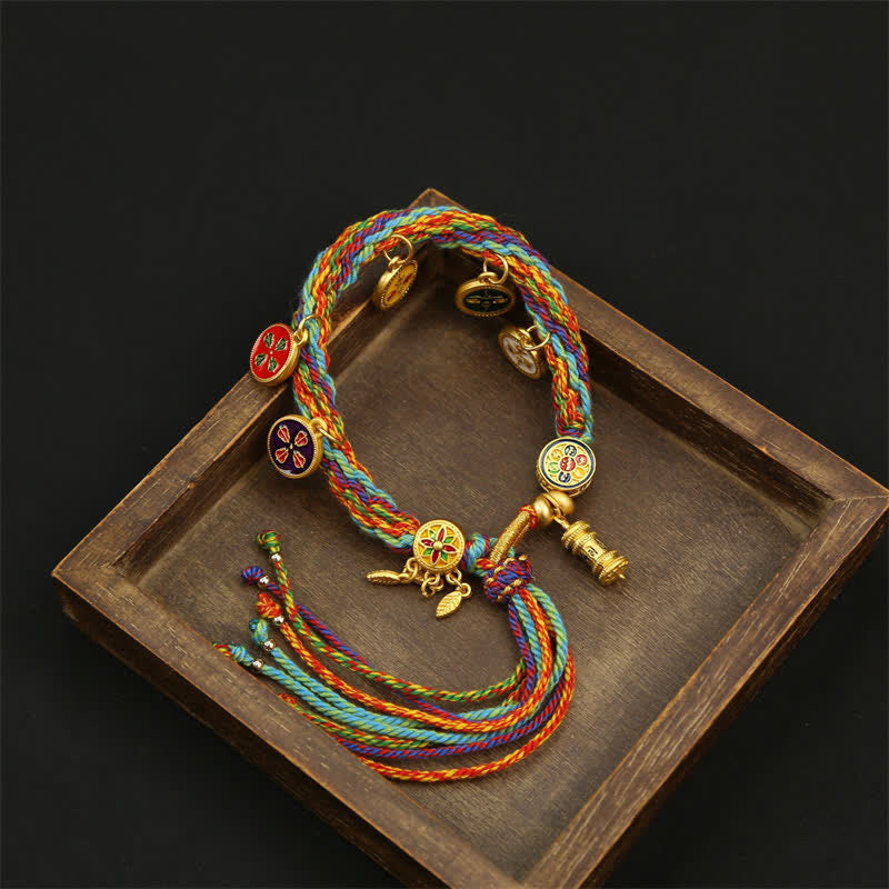 Buddha Stones Pulsera con borla de cuerda trenzada arcoíris Om Mani Padme Hum Sabiduría - image 1