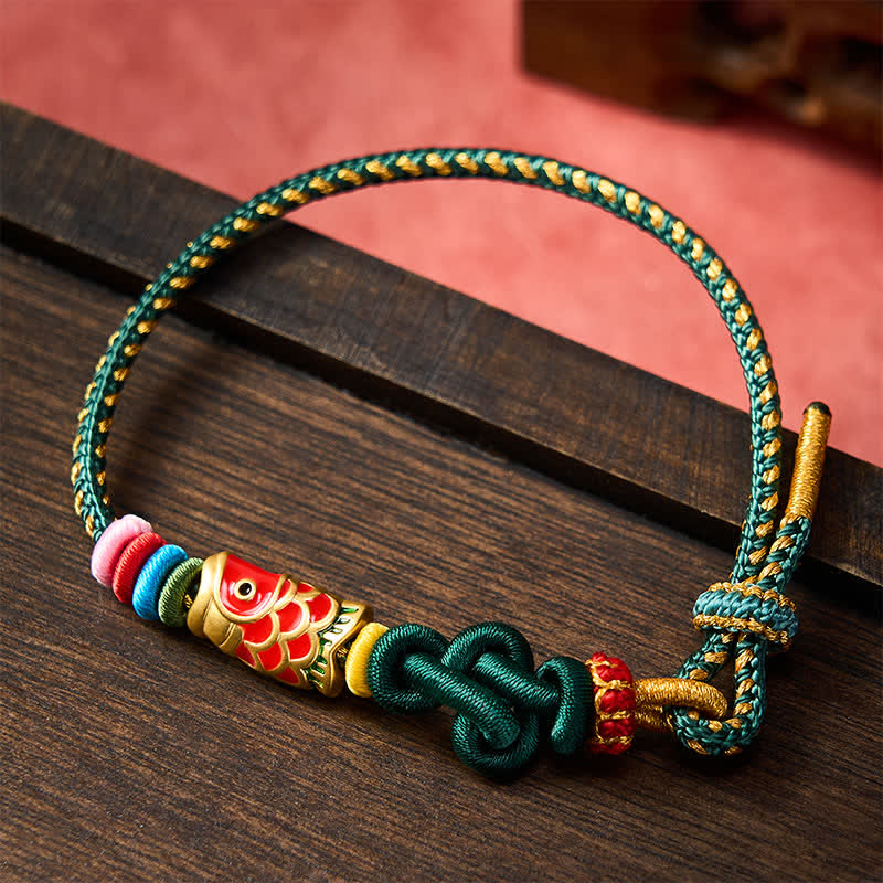 Buddha Stones Pulsera de protección tejida a mano con hilo verde oscuro y amarillo y diseño de pez koi rojo. - image 1