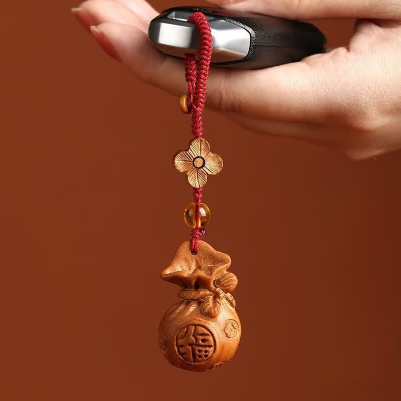 Buddha Stones Llaveros con dije de loto y bolsa de la suerte de madera de durazno Fu - image 4