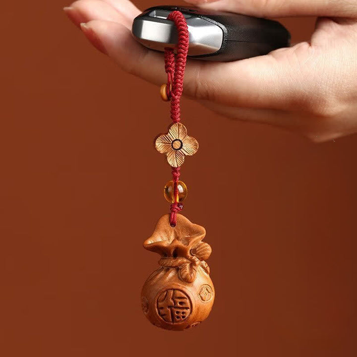 Buddha Stones Llaveros con dije de loto y bolsa de la suerte de madera de durazno Fu - image 4