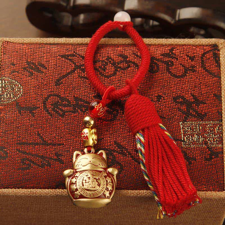 Buddha Stones Llaveros con borla de bendición de personaje Fu, de latón tejido a mano con cuerda roja. - image 1