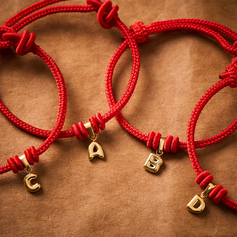 Buddha Stones Pulsera Faith de acero de titanio con letra roja - image 0