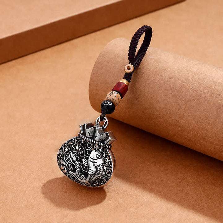 Buddha Stones Llaveros huecos de cobre antiguo con diseño de bolsa de dinero con peces koi. - Llaveros de peces koi - image 0