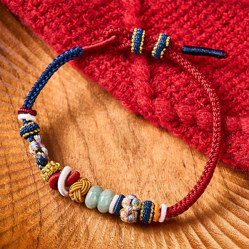 Buddha Stones Pulsera de hilo rojo y azul marino con cuentas de jade y flor de durazno tejida a mano - image 1