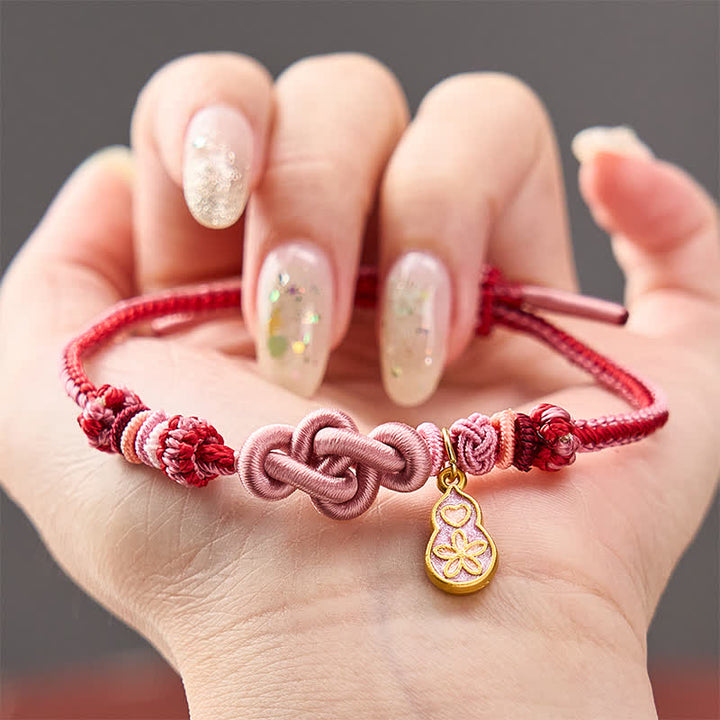 Buddha Stones Pulsera de hilo rosa con la frase "Hazte rico rápidamente" tejida a mano con la frase "Refuerza tu calabaza" - Rosa con accesorio de calabaza - image 0