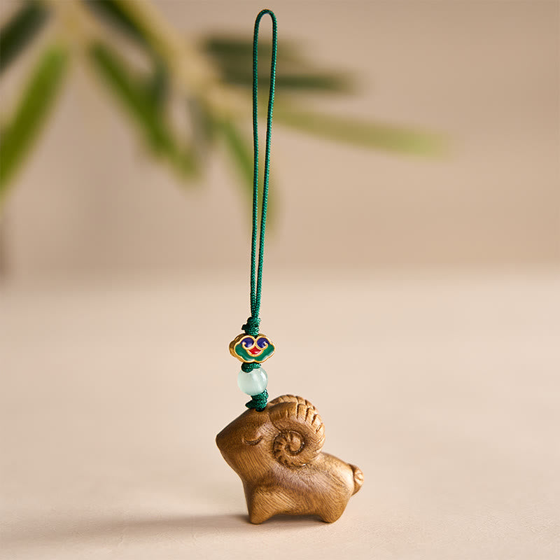 Buddha Stones Llaveros con la imagen de una cabra tallada a mano en madera de sándalo. - Verde - image 0