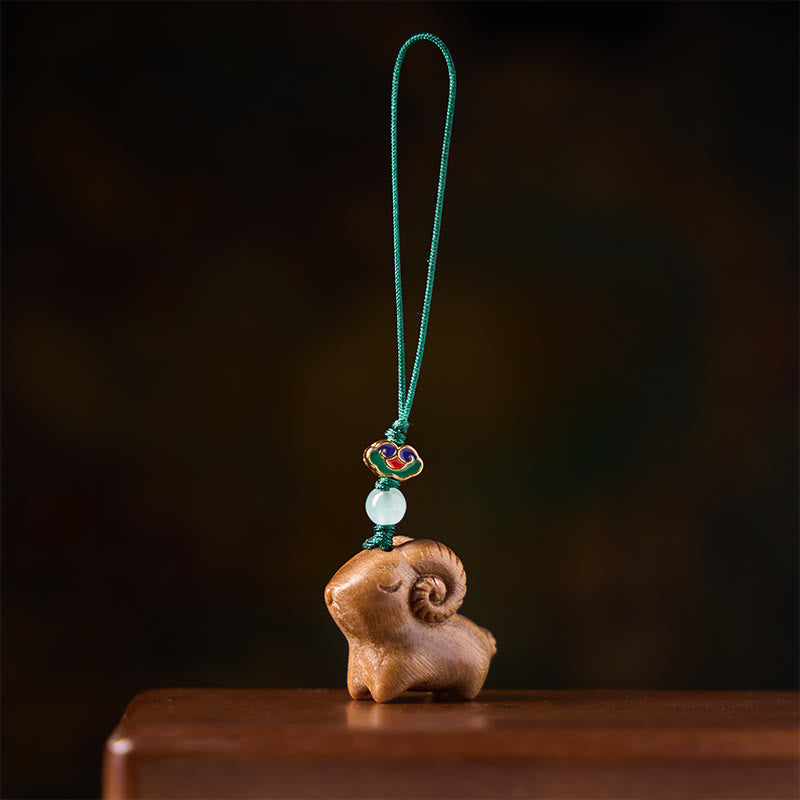 Buddha Stones Llaveros con la imagen de una cabra tallada a mano en madera de sándalo. - image 1