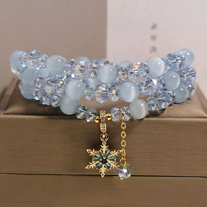 Buddha Stones Pulsera con dije de bendición de copo de nieve azul ojo de gato de triple vuelta - image 1