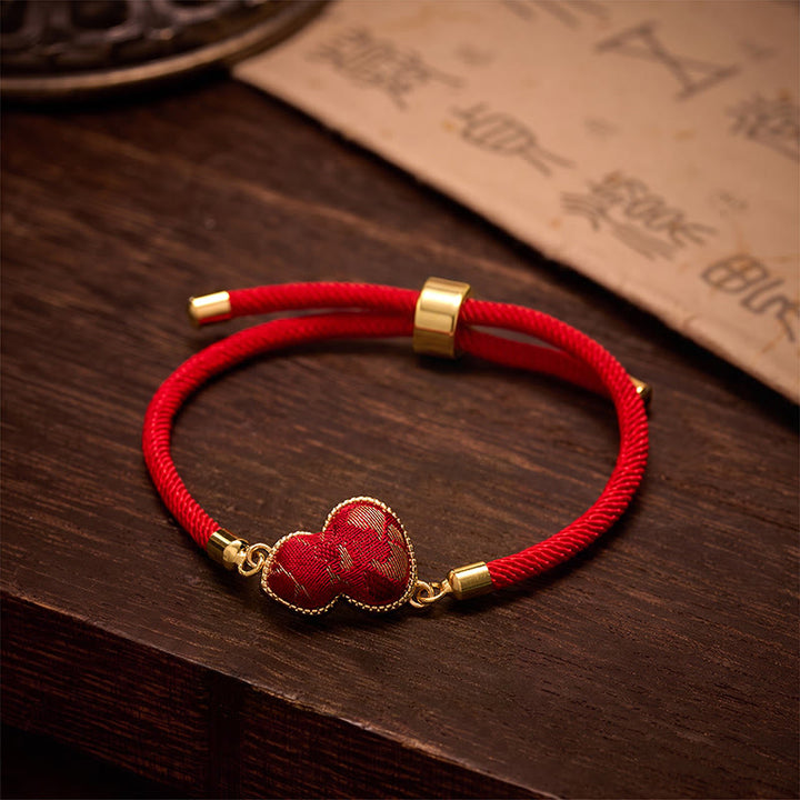 Buddha Stones Pulsera protectora de calabaza brocada con la canción del hilo rojo - Brocado Song (mismo tono de color, el estampado varía) - image 0