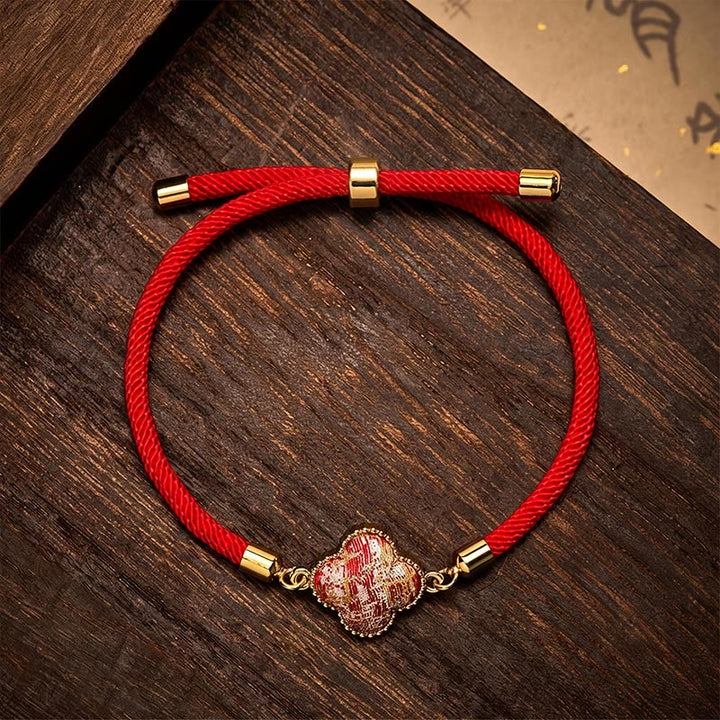 Buddha Stones Pulsera de la suerte con brocado de trébol de cuatro hojas y canción de hilo rojo - Brocado Song (mismo tono de color, el estampado varía) - image 0