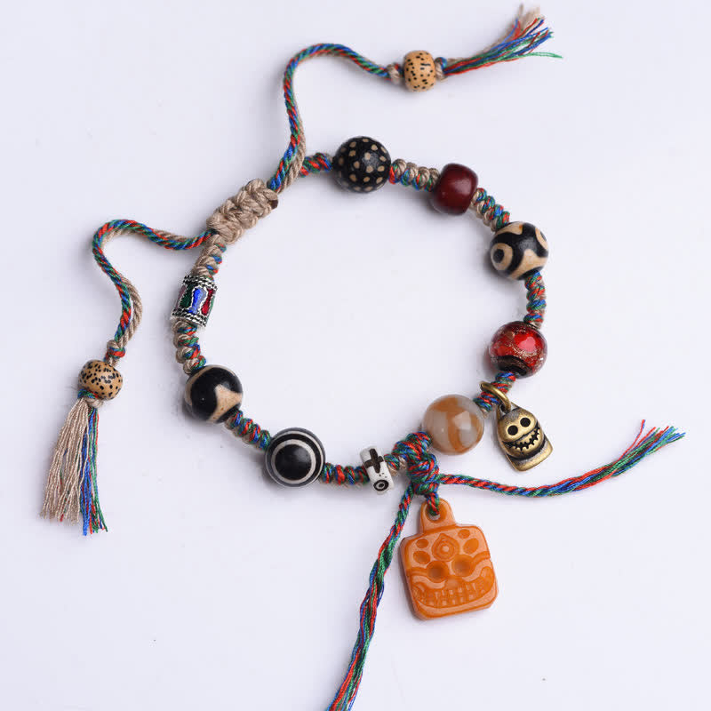 Buddha Stones Pulsera tibetana de cuentas Dzi, hueso trenzado, hilo multicolor, bendiciones - image 1