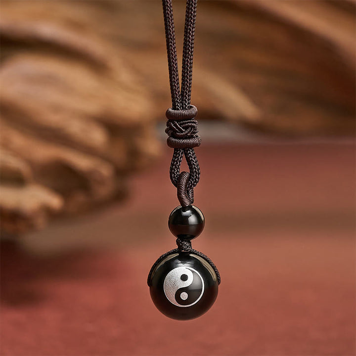 Buddha Stones Colgante de collar Yin Yang de purificación tallado en obsidiana negra - Patrón Yin Yang con lámina plateada - 26,8 pulgadas / 68 cm - image 0