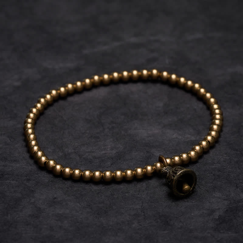 Buddha Stones Pulsera con colgante de campana y cuentas de cobre - image 1