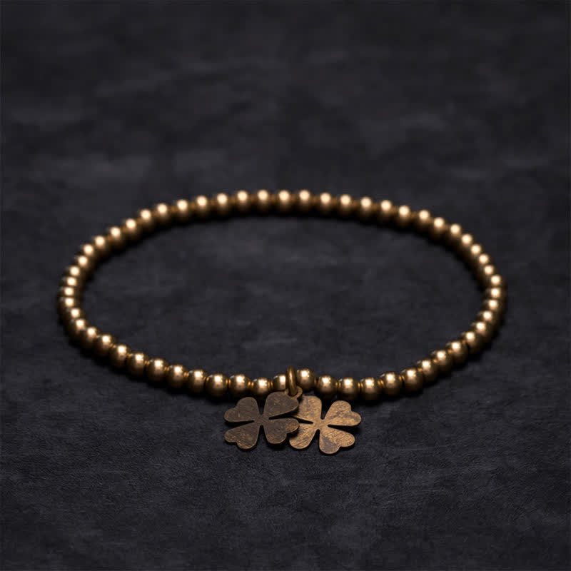Buddha Stones Pulsera de la suerte con dije de trébol de cuatro hojas y cuentas de cobre - image 1