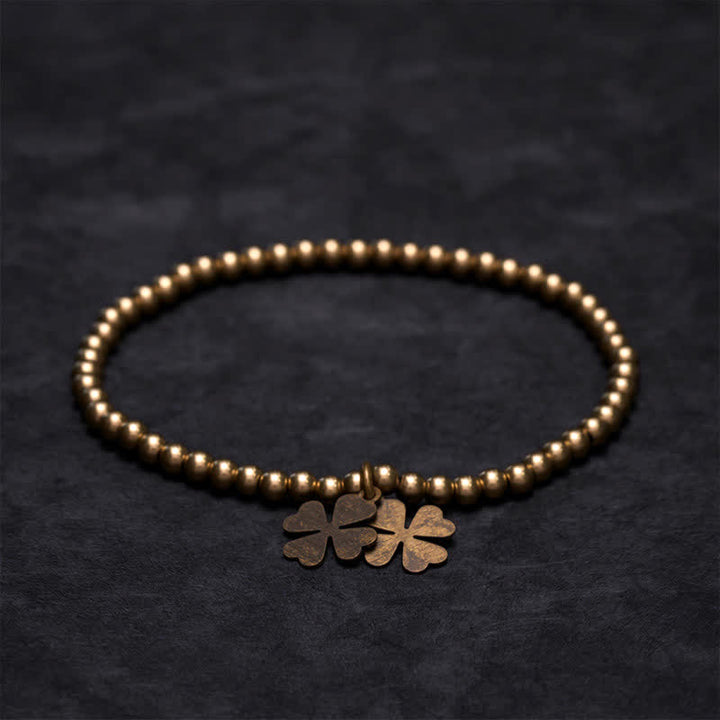 Buddha Stones Pulsera de la suerte con dije de trébol de cuatro hojas y cuentas de cobre - image 1