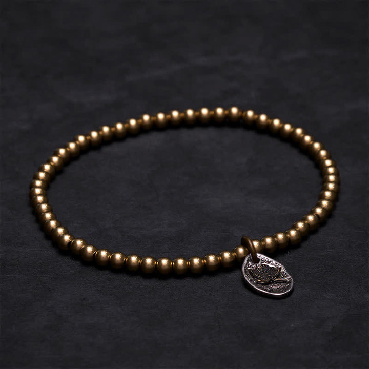 Buddha Stones Pulsera curativa con dije de loto y cuentas de cobre - image 1