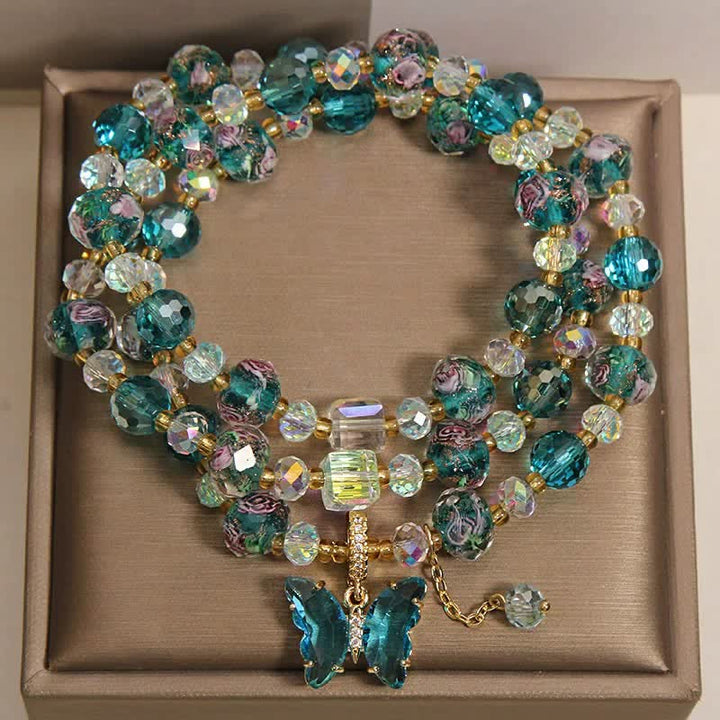 Buddha Stones Pulsera de triple vuelta con transformación de mariposa y cuentas de vidrio Liuli - image 1