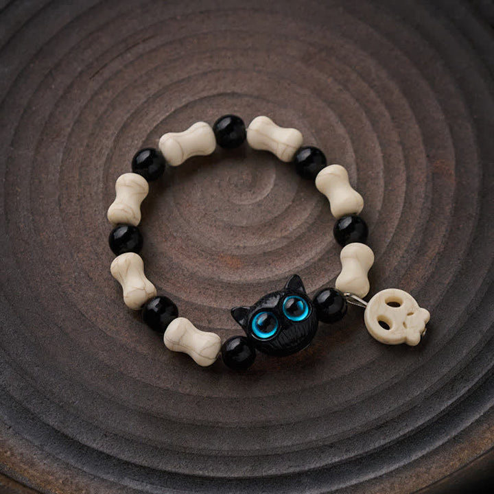 Buddha Stones Pulsera de fuerza con cuentas de calavera y gato negro - image 1