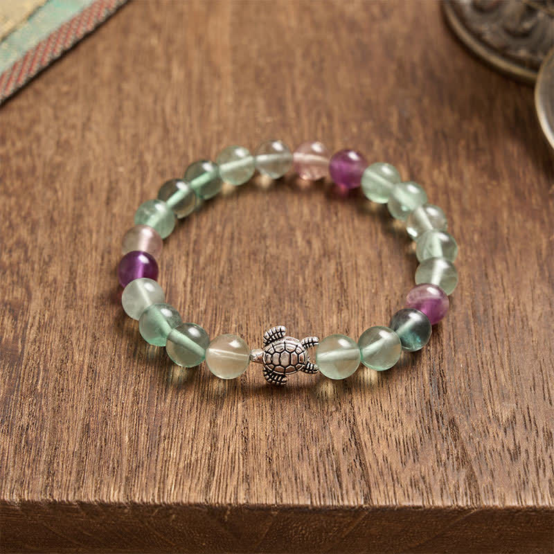 Buddha Stones Pulsera de cuentas de fluorita multicolor con forma de tortuga, que ofrece claridad y protección. - image 4