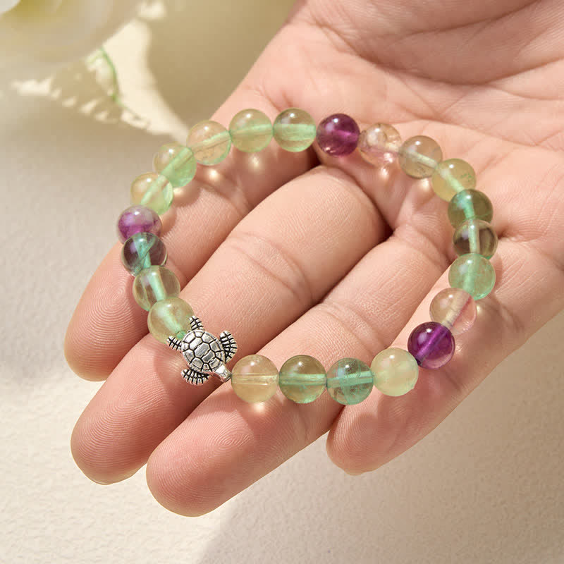 Buddha Stones Pulsera de cuentas de fluorita multicolor con forma de tortuga, que ofrece claridad y protección. - image 5