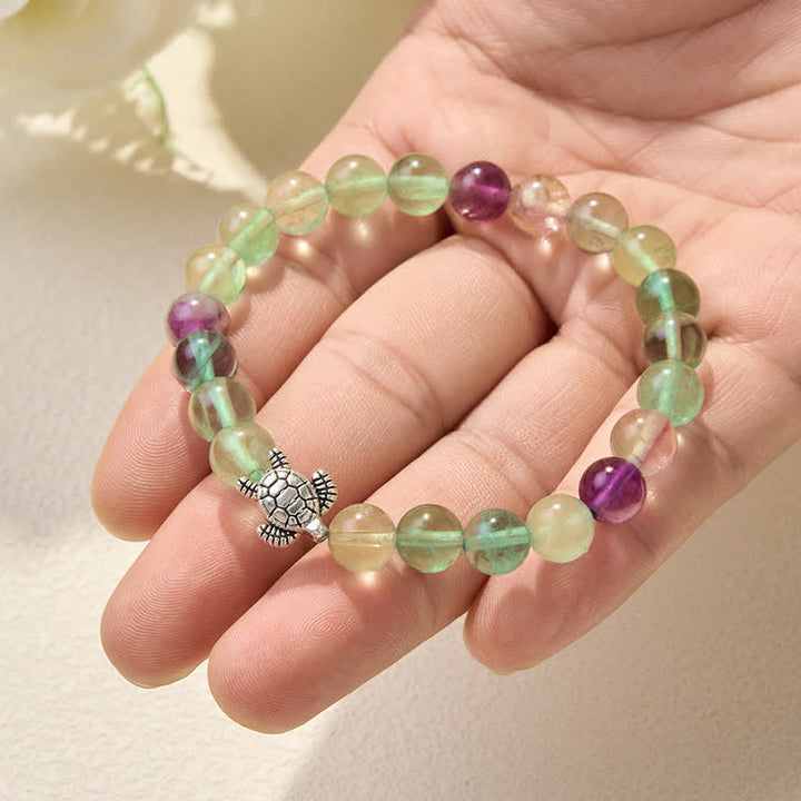 Buddha Stones Pulsera de cuentas de fluorita multicolor con forma de tortuga, que ofrece claridad y protección. - image 5