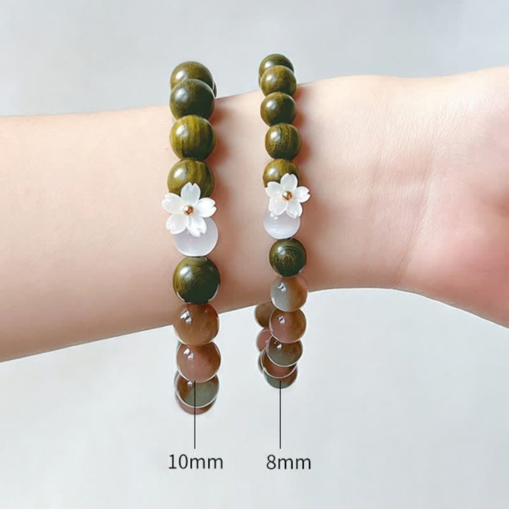 Buddha Stones Pulsera Serenity con dije de flor de ojo de gato y sándalo verde - image 10