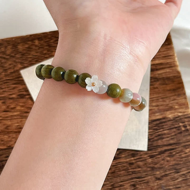 Buddha Stones Pulsera Serenity con dije de flor de ojo de gato y sándalo verde - image 4