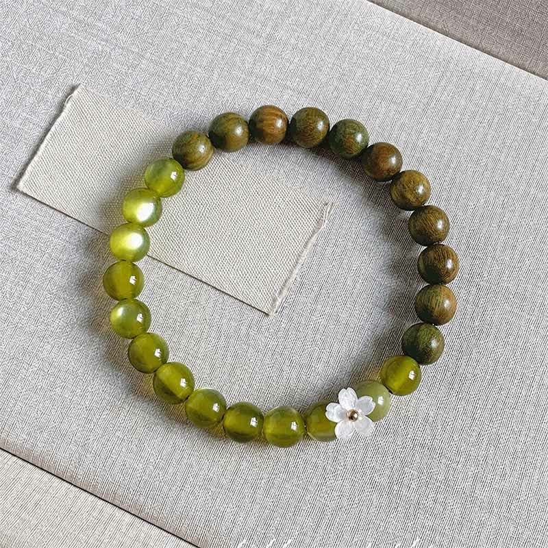 Buddha Stones Pulsera Serenity con dije de flor de ojo de gato y sándalo verde - Piedra ojo de gato de 8 mm - image 13