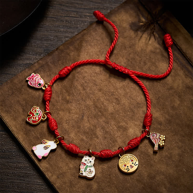 Buddha Stones Pulsera de la suerte hecha a mano con hilo rojo de siete nudos, con forma de pez koi, elefante, conejo, gato y urraca púrpura. - image 1