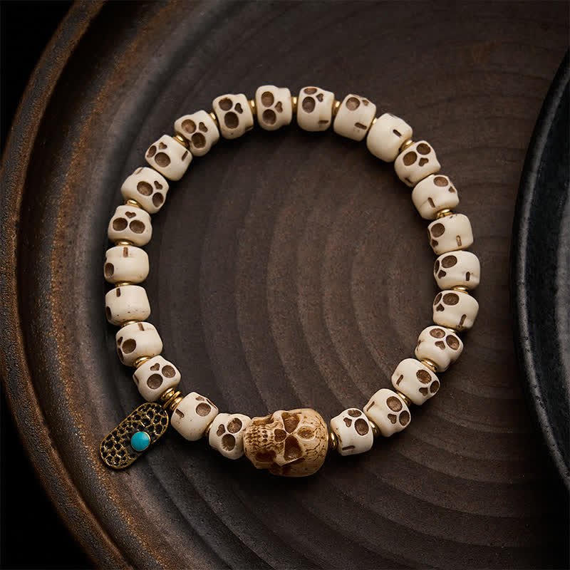Buddha Stones Pulsera tibetana con cuentas de hueso talladas a mano, diseño de calavera del Señor del Bosque de los Cadáveres, que simboliza la fuerza y ​​el cambio. - 9×6,3 mm - image 0