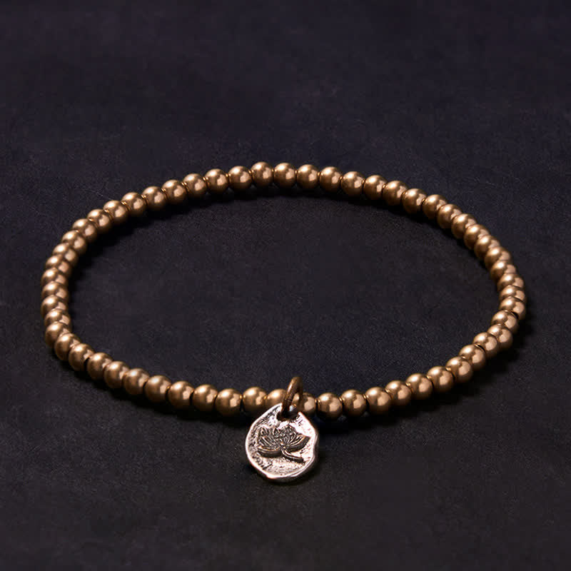 Buddha Stones Pulsera curativa con dije de loto y cuentas de cobre - image 1