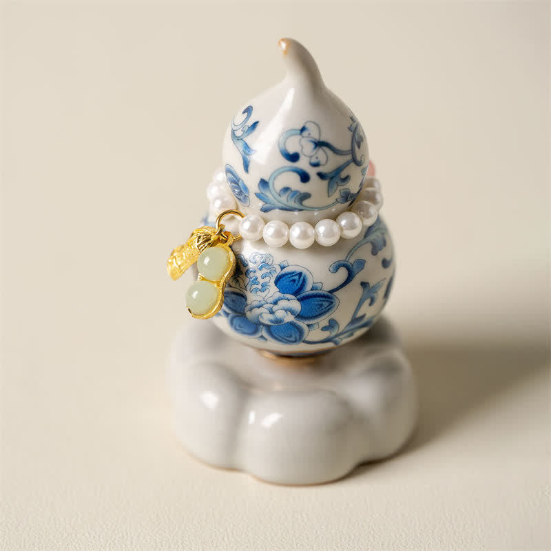 Buddha Stones Decoración de vida consciente con forma de calabaza y loto giratoria de cerámica azul y blanca - Base blanca aprox. 4,8 cm × 4,8 cm × 8,5 cm - image 0