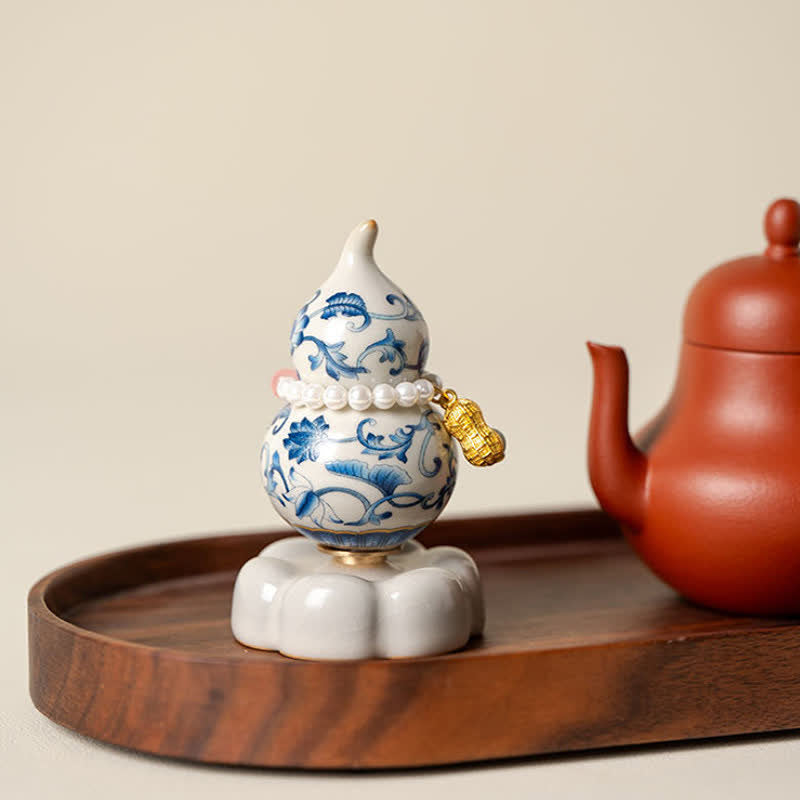 Buddha Stones Decoración de vida consciente con forma de calabaza y loto giratoria de cerámica azul y blanca - image 1