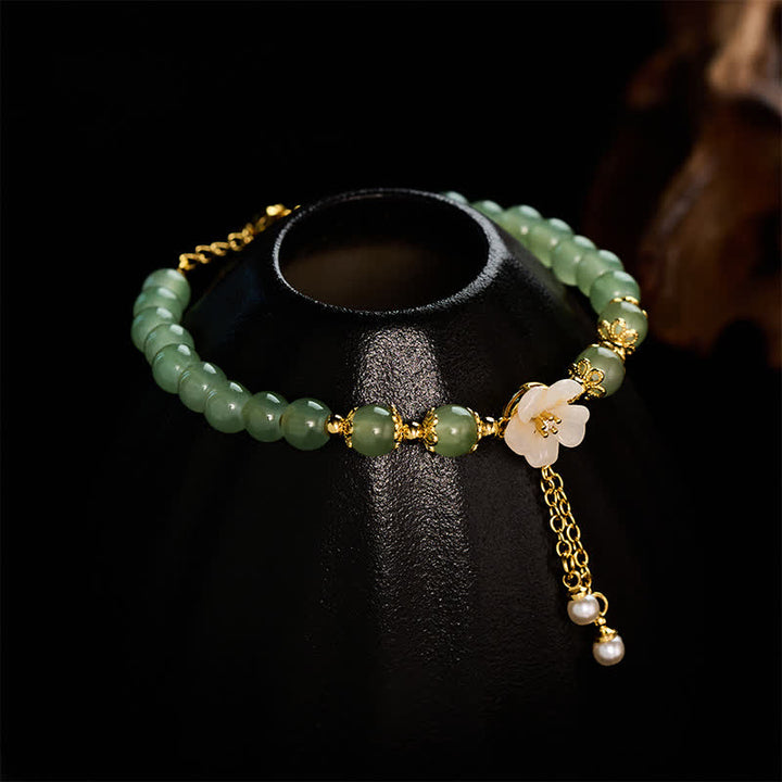 Buddha Stones Pulsera con dije de perlas y flor de la suerte inspirada en el jade Hetian de cobre - image 3