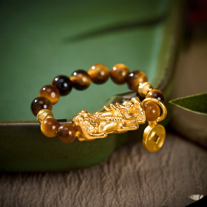 Buddha Stones Anillo pequeño elástico con cuentas de la moneda china Pi Xiu de la riqueza del ojo de tigre - Se ajusta a tallas US 6-8 (52-55 mm) - image 0