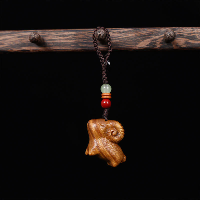 Buddha Stones Llaveros de la fortuna tallados a mano con forma de cabra, sándalo rojo y sándalo verde. - Cuerda trenzada - Sándalo verde - image 1