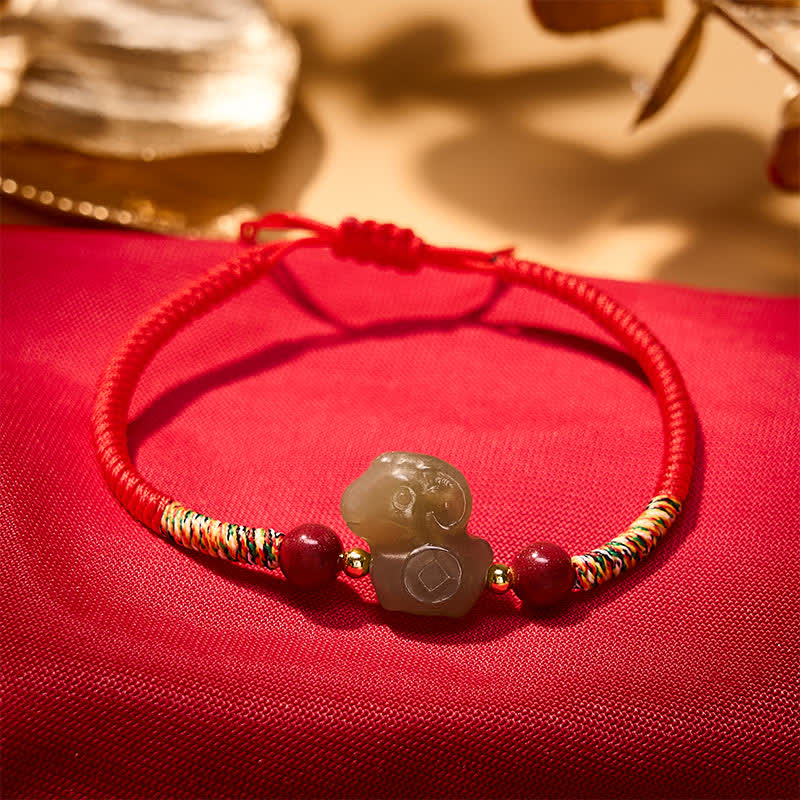 Buddha Stones Pulsera de hilo trenzado con dije de cabra de jade Hetian del Año de la Cabra y cinabrio. - image 1