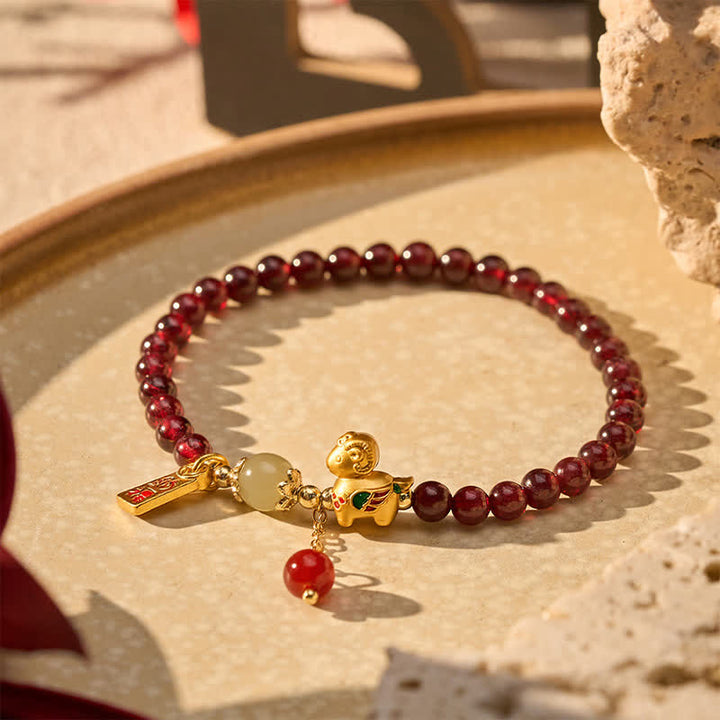 Buddha Stones Pulsera de protección con monedas de personajes de oveja linda y granate del año de la cabra, Granate, Cordero Fu - image 1