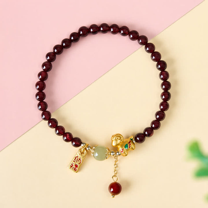 Buddha Stones Pulsera de protección con monedas de personajes de oveja linda y granate del año de la cabra, Granate, Cordero Fu - image 2
