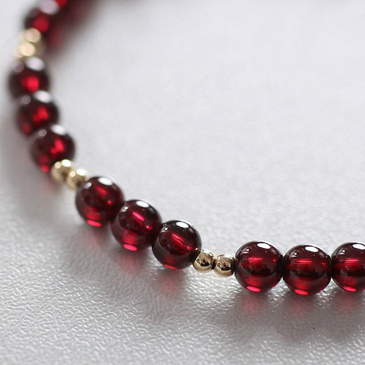 Pulsera Calm de granate natural de oro de 14 quilates con Buddha Stones