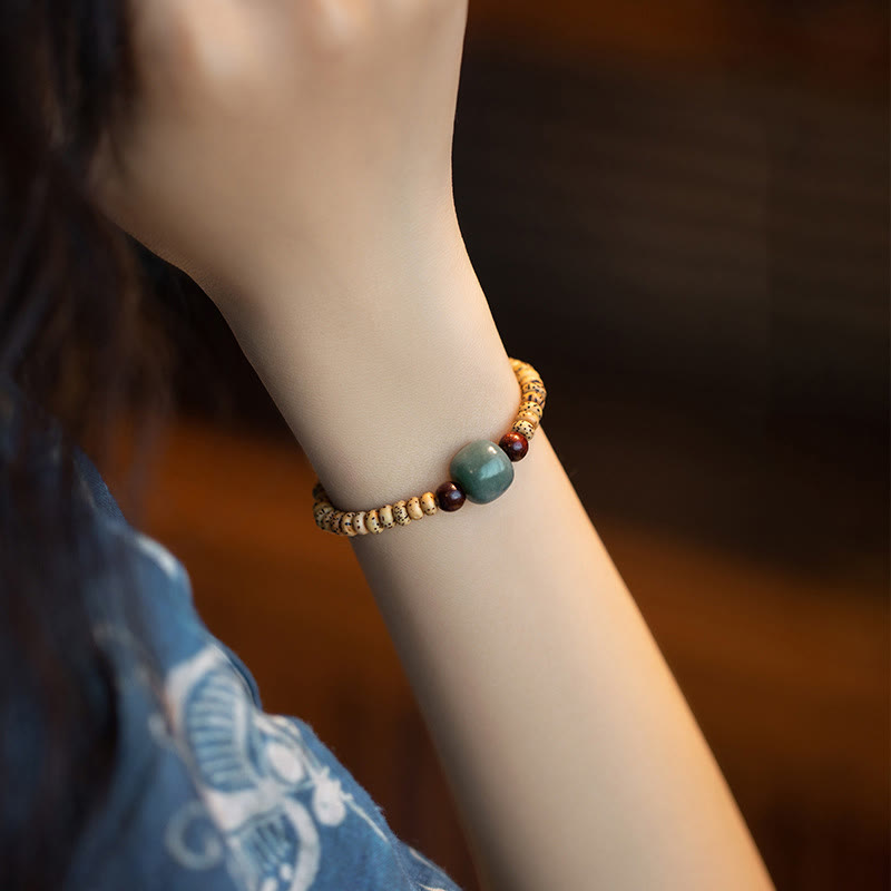 Pulsera de sabiduría de sándalo rojo con hojas pequeñas y semillas de Bodhi de Buddha Stones
