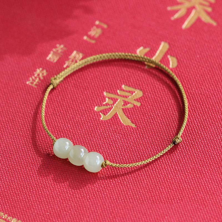 Pulsera de tejido de hilo de la suerte de jade con tres cuentas de piedras de Buddha Stones