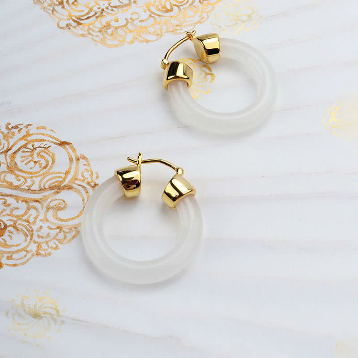 Pendientes de prosperidad de jade blanco redondo de Buddha Stones