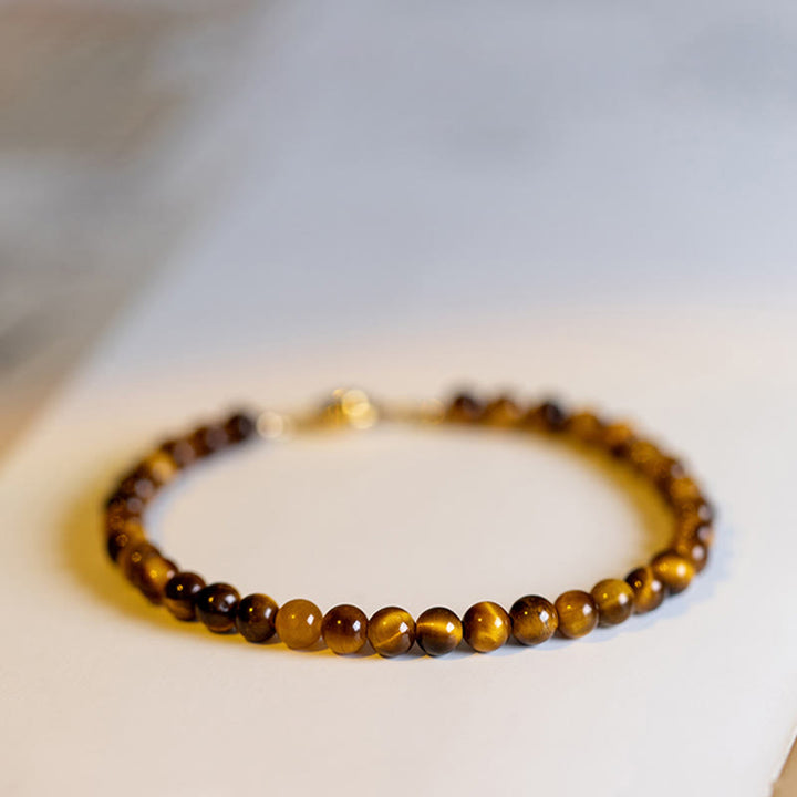 Buddha Stones Pulsera de protección de coraje con piedra de ojo de tigre natural chapada en oro de 14 quilates