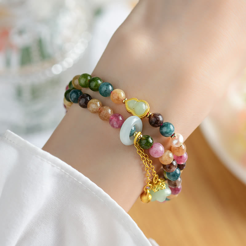 Pulsera con dije de lirio de los valles de doble envoltura de sabiduría de calabaza de turmalina multicolor con Buddha Stones