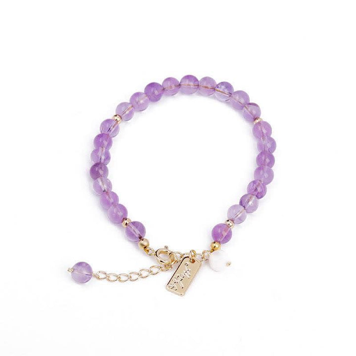 Pulsera de cristal de amatista natural que alivia el estrés.