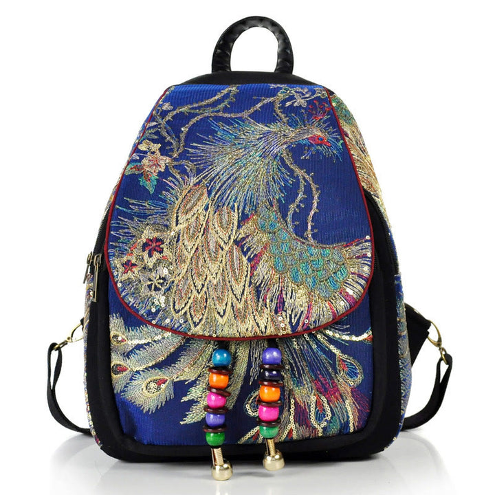 Mochila con borlas de lona con bordado de pavo real