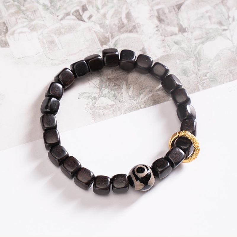 Pulsera de equilibrio de cuentas Dzi de madera de ébano tibetano con Buddha Stones